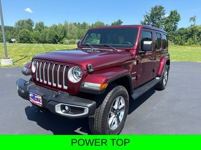 2021 Jeep Wrangler Unlimited Sahara in Snazzberry Pearl — front three-quarter view
